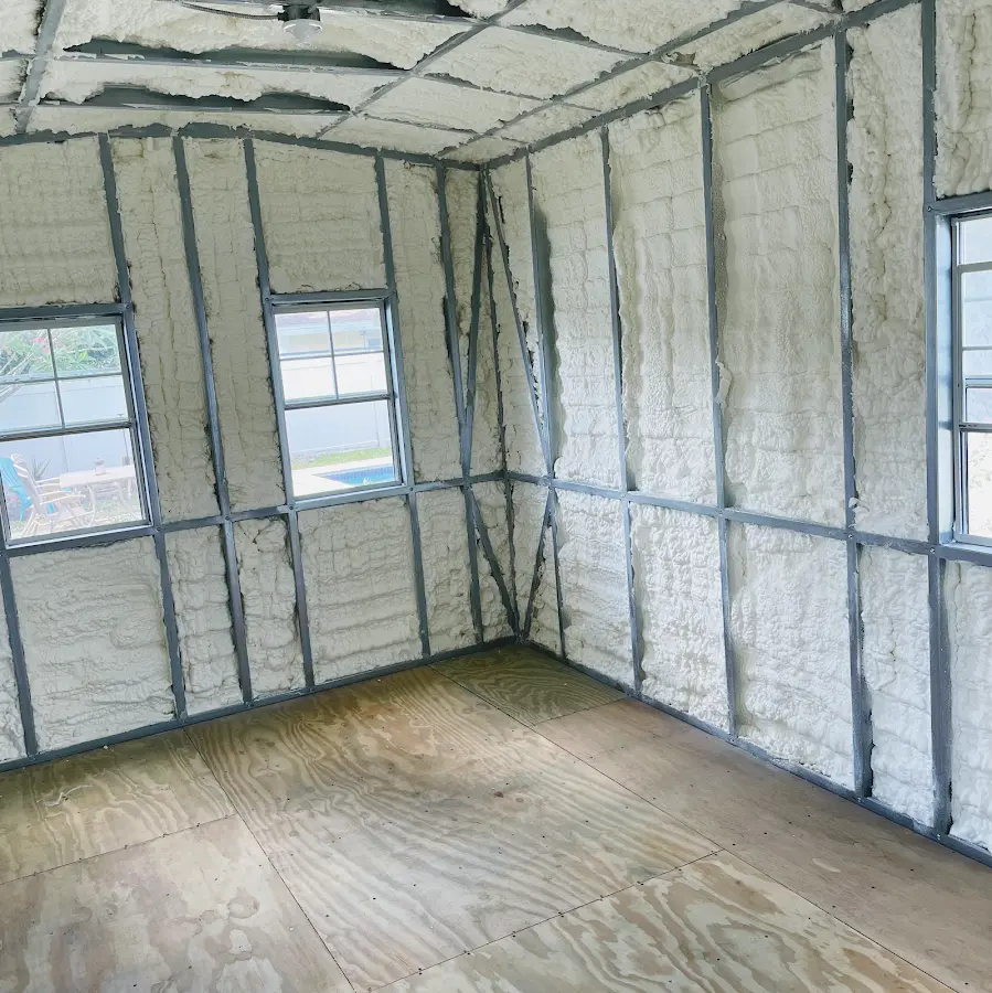 Closed-cell spray foam insulation applied to wall cavities in a residential project in Crowley